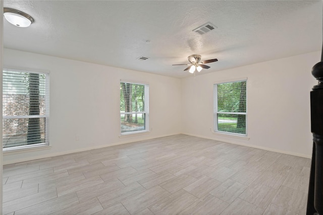 6 Sylvan Forest Dr, The Woodlands, TX 77381 - unfurnished room with ceiling fan and a textured ceiling