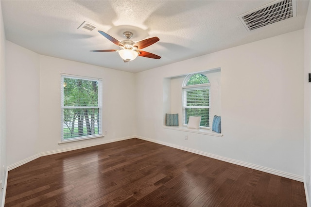 6 Sylvan Forest Dr, The Woodlands, TX 77381 - unfurnished room featuring dark wood finished floors, ceiling fan, and a textured ceiling