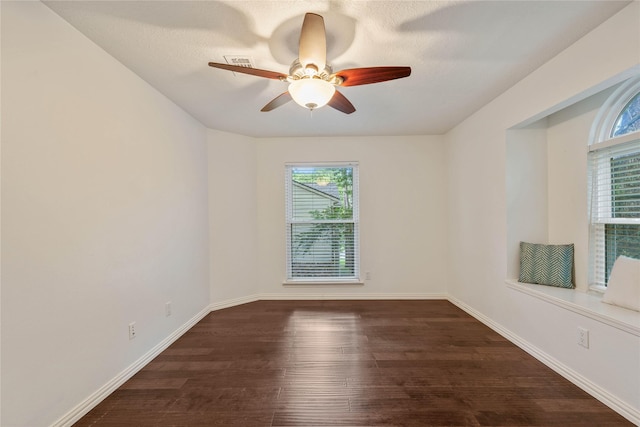 6 Sylvan Forest Dr, The Woodlands, TX 77381 - empty room featuring dark wood finished floors and a ceiling fan