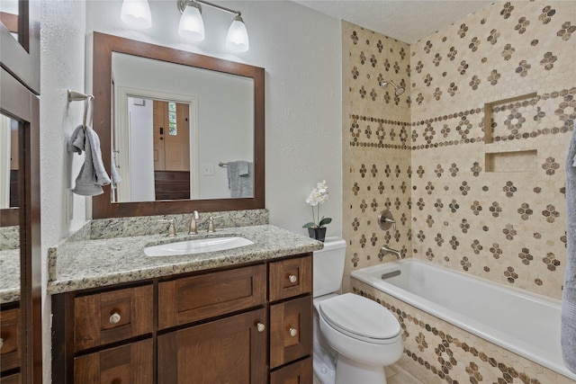 6 Sylvan Forest Dr, The Woodlands, TX 77381 - bathroom featuring vanity, a textured ceiling, tiled shower / bath combo, and a textured wall