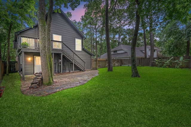 6 Sylvan Forest Dr, The Woodlands, TX 77381 - rear view of property featuring stairway, a fenced backyard, and a deck