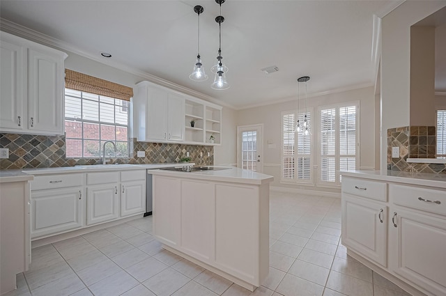 1902 Rosebay Ct, Sugar Land, TX 77479 - kitchen featuring light tile patterned floors, backsplash, white cabinetry, and crown molding