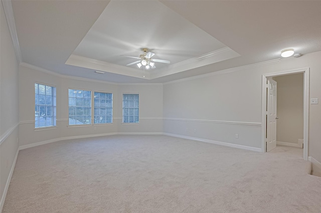 1902 Rosebay Ct, Sugar Land, TX 77479 - unfurnished room featuring a tray ceiling, light carpet, a ceiling fan, ornamental molding, and a smoke detector