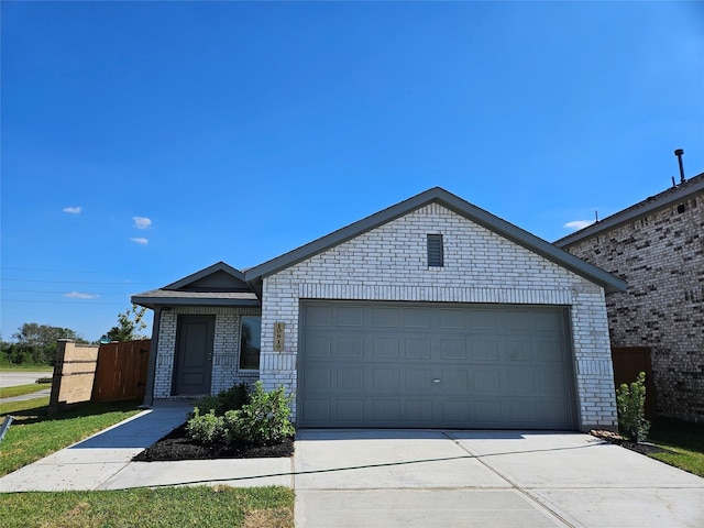 10734 Red Orchid Dr, Houston, TX 77016 - single story home with brick siding, concrete driveway, and an attached garage