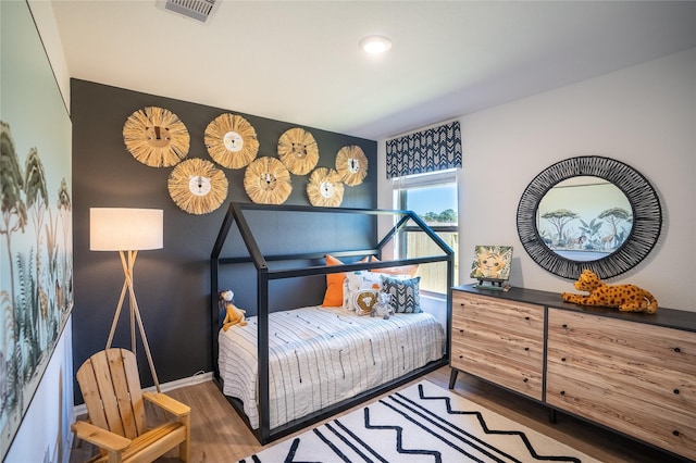 10734 Red Orchid Dr, Houston, TX 77016 - bedroom with wood finished floors
