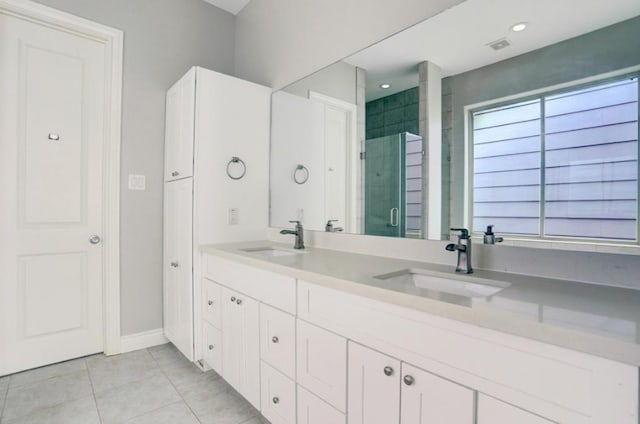 8907 Spring Knoll Forest Dr, Houston, TX 77080 - bathroom featuring double vanity, tile patterned floors, and a shower stall