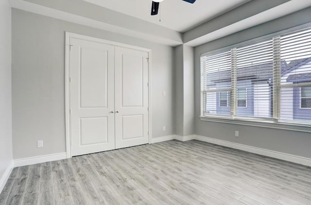 8907 Spring Knoll Forest Dr, Houston, TX 77080 - unfurnished bedroom featuring light wood-style floors, a closet, and a ceiling fan