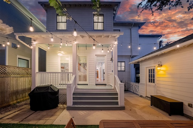 829 Ralfallen St, Houston, TX 77008 - back of property at dusk with covered porch
