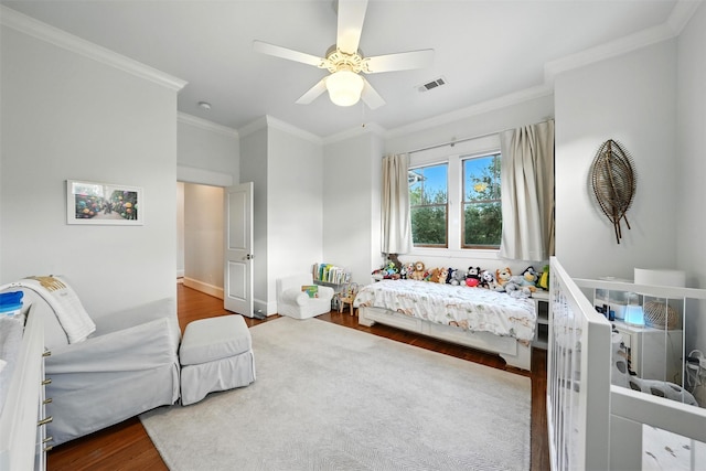 829 Ralfallen St, Houston, TX 77008 - bedroom with wood finished floors, crown molding, and ceiling fan