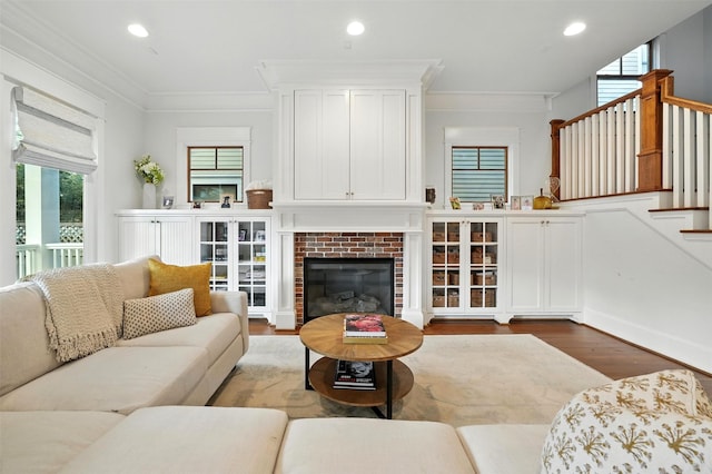 829 Ralfallen St, Houston, TX 77008 - living area with wood finished floors, stairway, crown molding, recessed lighting, and a fireplace