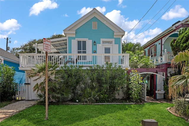 1805 19th St, Galveston, TX 77550 - view of front of property with a front lawn
