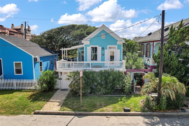 1805 19th St, Galveston, TX 77550 - bungalow-style house featuring a front yard and a garage