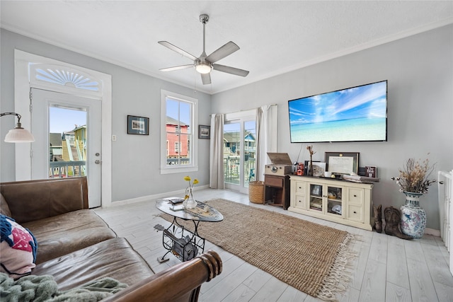 1805 19th St, Galveston, TX 77550 - living area featuring crown molding, ceiling fan, and light wood-style floors