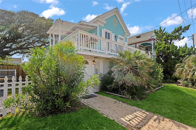 1805 19th St, Galveston, TX 77550 - view of side of property with a balcony