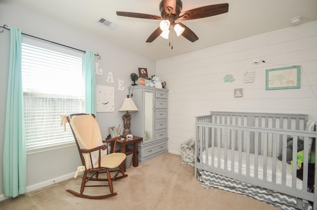 22218 Woodseem Ct, Katy, TX 77449 - bedroom with a nursery area, multiple windows, and light carpet