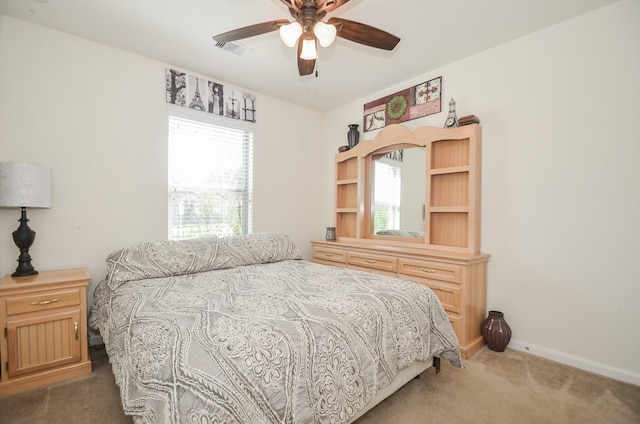 22218 Woodseem Ct, Katy, TX 77449 - carpeted bedroom with baseboards and a ceiling fan