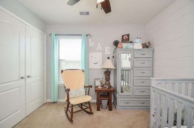 22218 Woodseem Ct, Katy, TX 77449 - bedroom featuring light colored carpet, a nursery area, and a ceiling fan