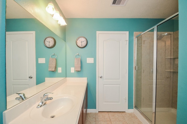 22218 Woodseem Ct, Katy, TX 77449 - full bath featuring tile patterned flooring, a stall shower, and vanity