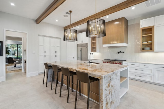 4618 Devon St, Houston, TX 77027 - kitchen featuring built in fridge, beam ceiling, open shelves, a large island, and decorative backsplash