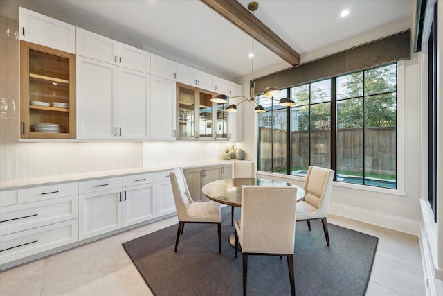 4618 Devon St, Houston, TX 77027 - dining space with beam ceiling, light tile patterned floors, and recessed lighting