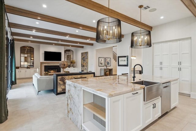 4618 Devon St, Houston, TX 77027 - kitchen with a center island with sink, dishwasher, beam ceiling, open shelves, and a lit fireplace