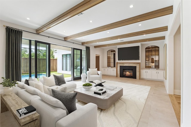 4618 Devon St, Houston, TX 77027 - living room featuring beamed ceiling, recessed lighting, a glass covered fireplace, and light tile patterned flooring