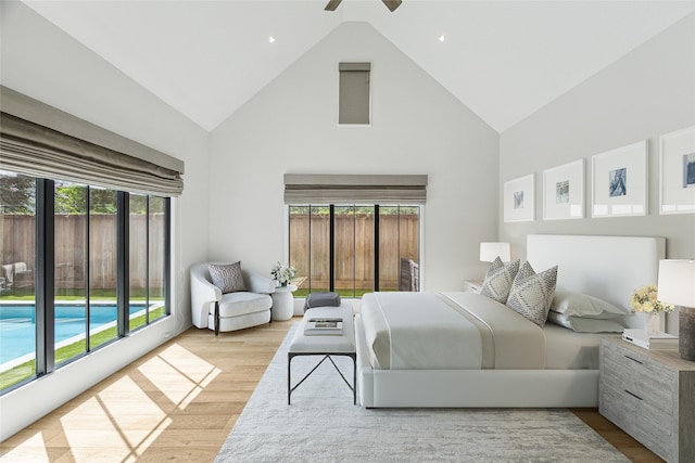 4618 Devon St, Houston, TX 77027 - bedroom featuring high vaulted ceiling, multiple windows, wood finished floors, and recessed lighting