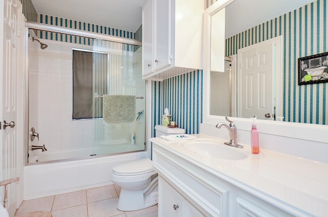 2014 Shadow Forest Dr, Katy, TX 77494 - bathroom with wallpapered walls, vanity, bath / shower combo with glass door, and tile patterned floors