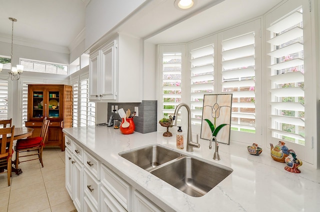 2014 Shadow Forest Dr, Katy, TX 77494 - kitchen with white cabinetry, plenty of natural light, crown molding, and hanging light fixtures