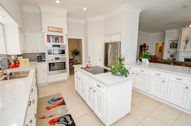 2014 Shadow Forest Dr, Katy, TX 77494 - kitchen with stainless steel appliances, a kitchen island, light tile patterned flooring, crown molding, and light stone counters