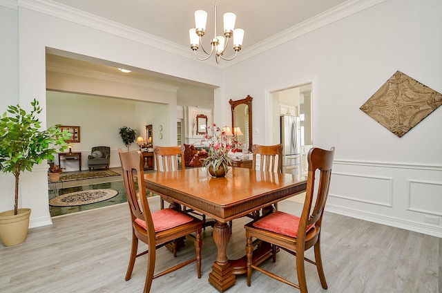 2014 Shadow Forest Dr, Katy, TX 77494 - dining area featuring a chandelier, light wood-style floors, and crown molding