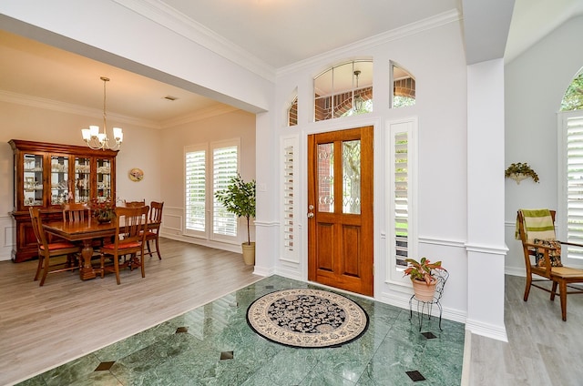 2014 Shadow Forest Dr, Katy, TX 77494 - entrance foyer with a chandelier, wood finished floors, and ornamental molding