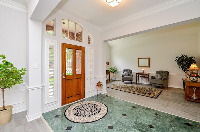 2014 Shadow Forest Dr, Katy, TX 77494 - entrance foyer featuring wood finished floors, ornamental molding, and a wainscoted wall