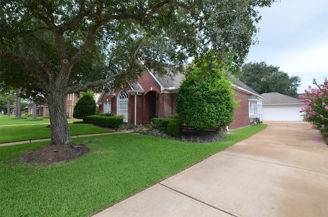 2014 Shadow Forest Dr, Katy, TX 77494 - view of property hidden behind natural elements with brick siding, a front yard, a garage, and a shingled roof