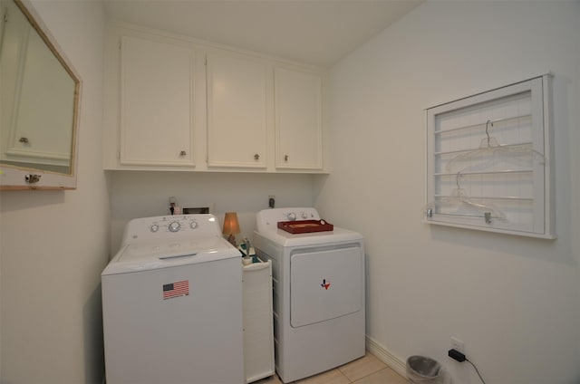 2014 Shadow Forest Dr, Katy, TX 77494 - laundry area featuring cabinet space, washer and clothes dryer, and light tile patterned flooring