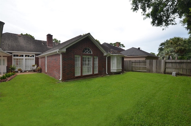 2014 Shadow Forest Dr, Katy, TX 77494 - rear view of house with brick siding and a chimney