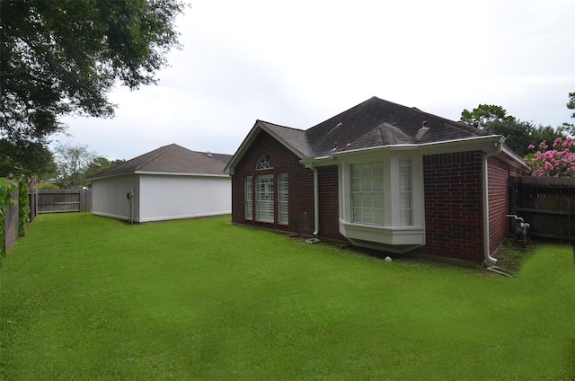 2014 Shadow Forest Dr, Katy, TX 77494 - back of house featuring brick siding, a fenced backyard, and a shingled roof