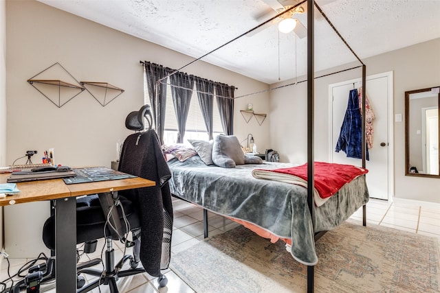 7307 Sunlight Ln, Houston, TX 77095 - tiled bedroom with a textured ceiling, a ceiling fan, and an office area
