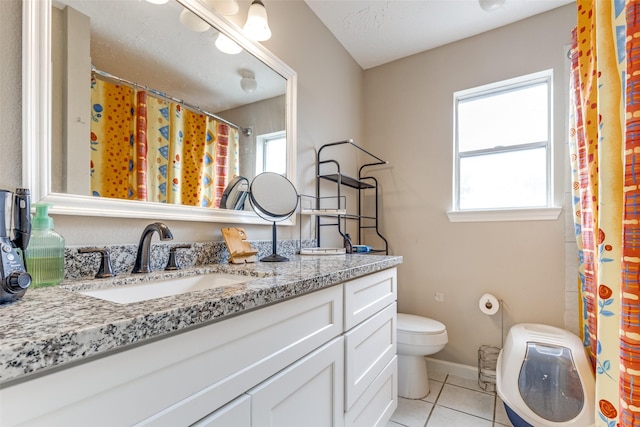 7307 Sunlight Ln, Houston, TX 77095 - full bath with vanity, tile patterned flooring, healthy amount of natural light, and curtained shower