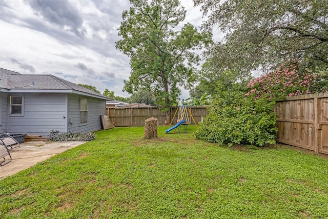 7307 Sunlight Ln, Houston, TX 77095 - fenced backyard featuring a playground and a patio area