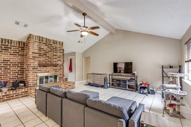 7307 Sunlight Ln, Houston, TX 77095 - living room featuring light tile patterned floors, ceiling fan, beamed ceiling, a fireplace, and high vaulted ceiling