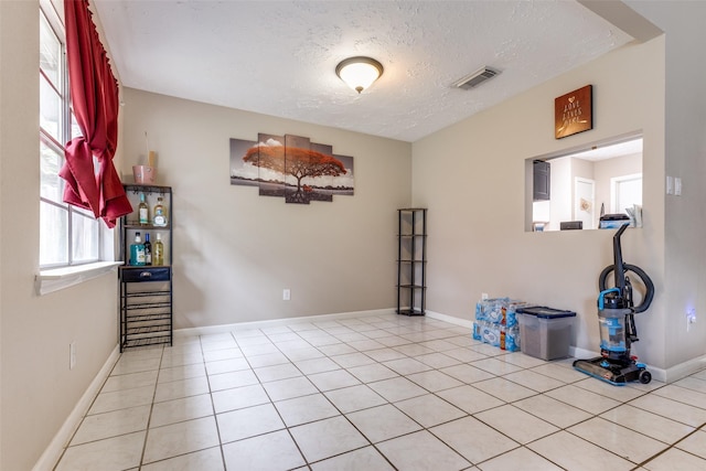 7307 Sunlight Ln, Houston, TX 77095 - spare room with a textured ceiling and tile patterned flooring