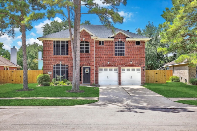 18219 Water Mill Dr, Cypress, TX 77429 - view of front of house featuring driveway, brick siding, an attached garage, a gate, and a shingled roof