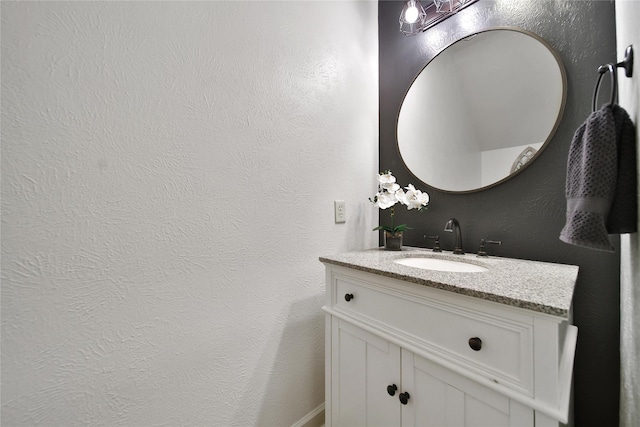 18219 Water Mill Dr, Cypress, TX 77429 - bathroom with vanity and a textured wall