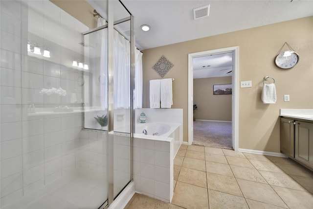 18219 Water Mill Dr, Cypress, TX 77429 - full bath featuring vanity, a garden tub, a shower stall, and tile patterned floors