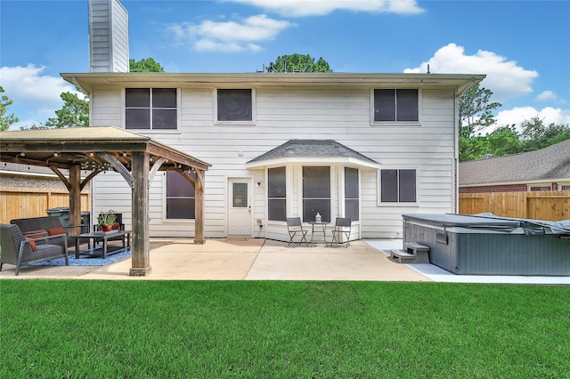 18219 Water Mill Dr, Cypress, TX 77429 - back of house with a hot tub, a gazebo, a fenced backyard, and a patio