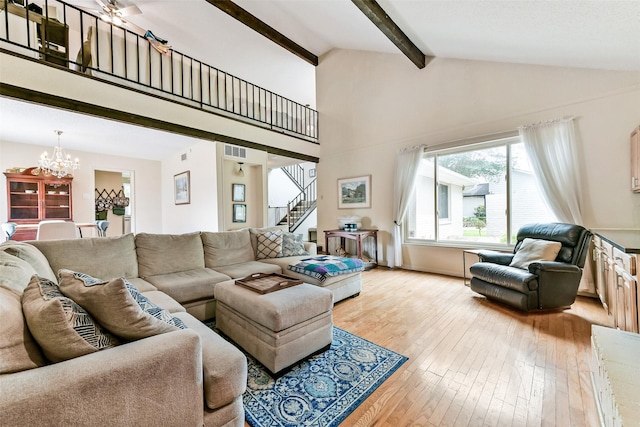 3510 Ledgestone Dr, Houston, TX 77059 - living area featuring a chandelier, stairway, light wood-style floors, beam ceiling, and high vaulted ceiling