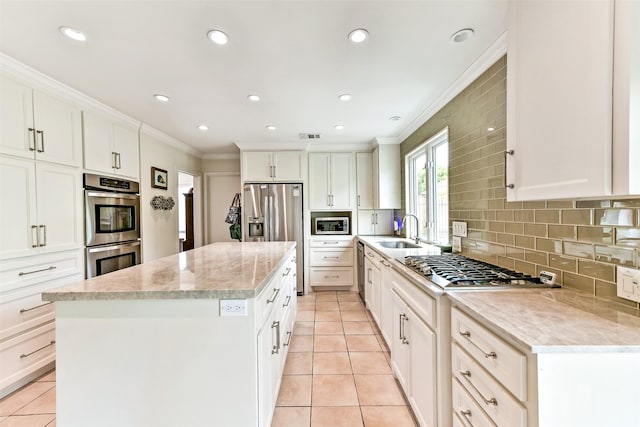 3510 Ledgestone Dr, Houston, TX 77059 - kitchen featuring crown molding, stainless steel appliances, a center island, light tile patterned floors, and tasteful backsplash