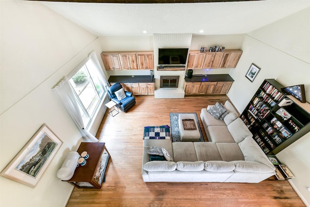 3510 Ledgestone Dr, Houston, TX 77059 - living area with wood finished floors, lofted ceiling, and recessed lighting