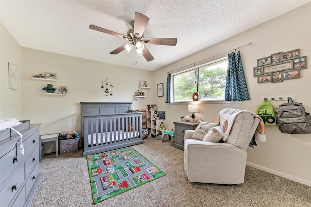 3510 Ledgestone Dr, Houston, TX 77059 - bedroom featuring a nursery area, light colored carpet, a textured ceiling, and ceiling fan